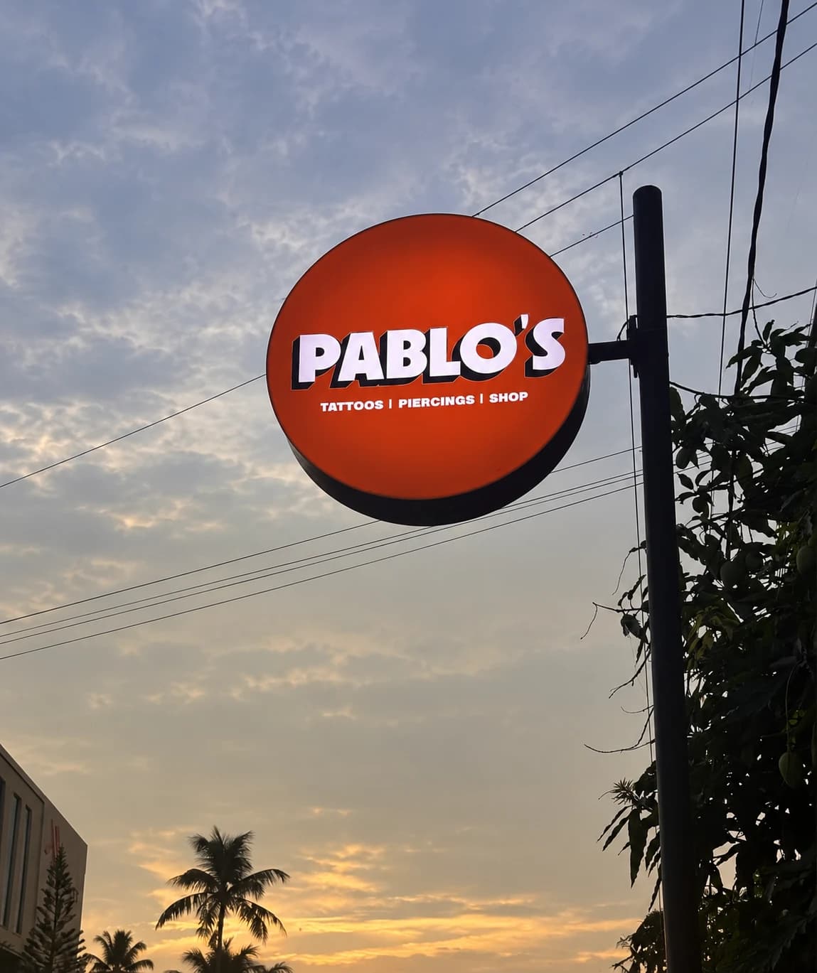 Pablo's tattoo and piercing shop sign